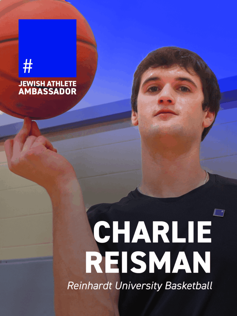 Charlie Reisman, Reinhardt University basketball player, spinning a basketball on his finger, identified as a Jewish Athlete Ambassador.