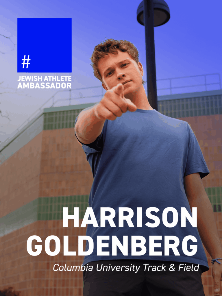 Harrison Goldenberg, Columbia University track and field athlete, pointing toward the camera outdoors, identified as a Jewish Athlete Ambassador.