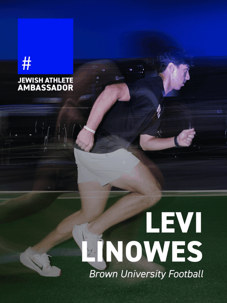 Levi Linowes, Brown University football player, sprinting indoors on turf, featured as a Jewish Athlete Ambassador.