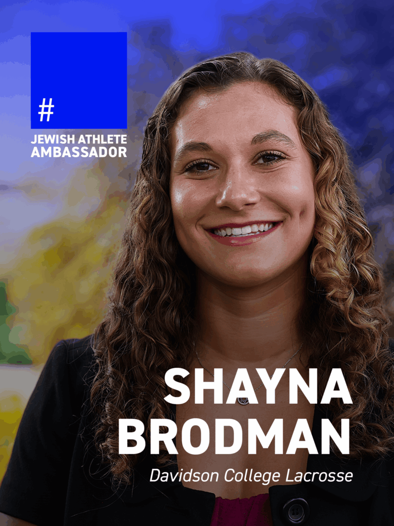 Shayna Brodman, Davidson College lacrosse player, smiling in an outdoor portrait, identified as a Jewish Athlete Ambassador.