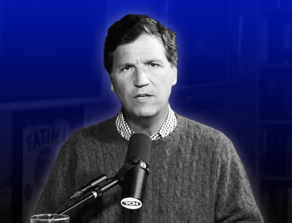 Tucker Carlson seated at a podcast microphone, wearing a sweater over a collared shirt, speaking directly toward the camera with a serious expression. The image is in black and white with a blue-toned background, and a studio setting with shelves is faintly visible behind him.