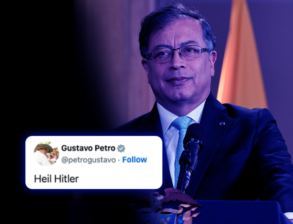 A blue-tinted image of a man in a suit and glasses speaking at a podium with a microphone. An overlaid screenshot of a social media post appears in the lower-left corner, showing an account labeled “Gustavo Petro” and displaying the text “Heil Hitler.” The background is dark and blurred, with a flag visible behind the speaker.