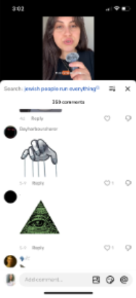 Screenshot of a social media comment section featuring imagery associated with antisemitic conspiracy theories, including a puppet-master hand and an all-seeing-eye symbol used to imply hidden control.
