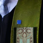 A Blue Square pin on a green clergy stole at St. Luke’s Methodist Church during Stand Up Sunday.